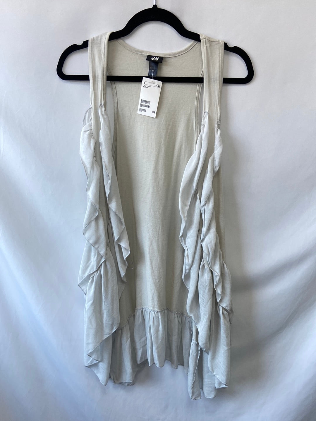 H&M. Chaleco beige volantes T.M