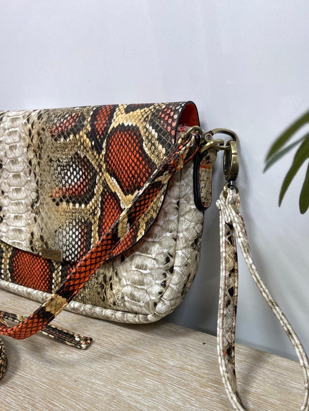 MISAKO. Beige and orange animal print bag