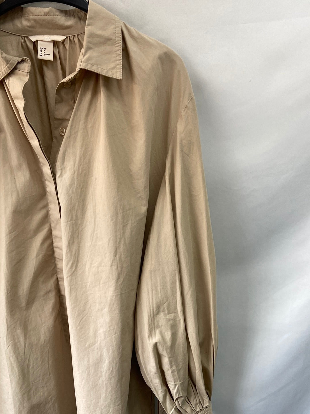 H&M. Camisa con lazada T.38