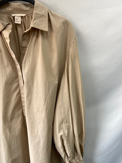H&M. Camisa con lazada T.38