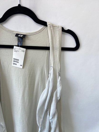 H&M. Chaleco beige volantes T.M
