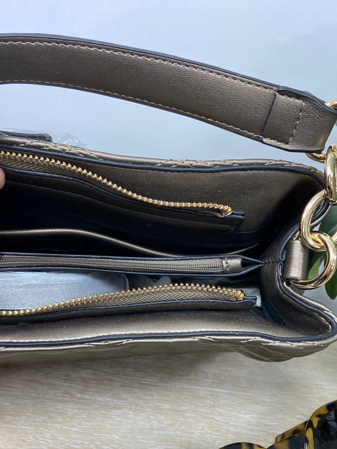 ECI. Quilted bronze bag