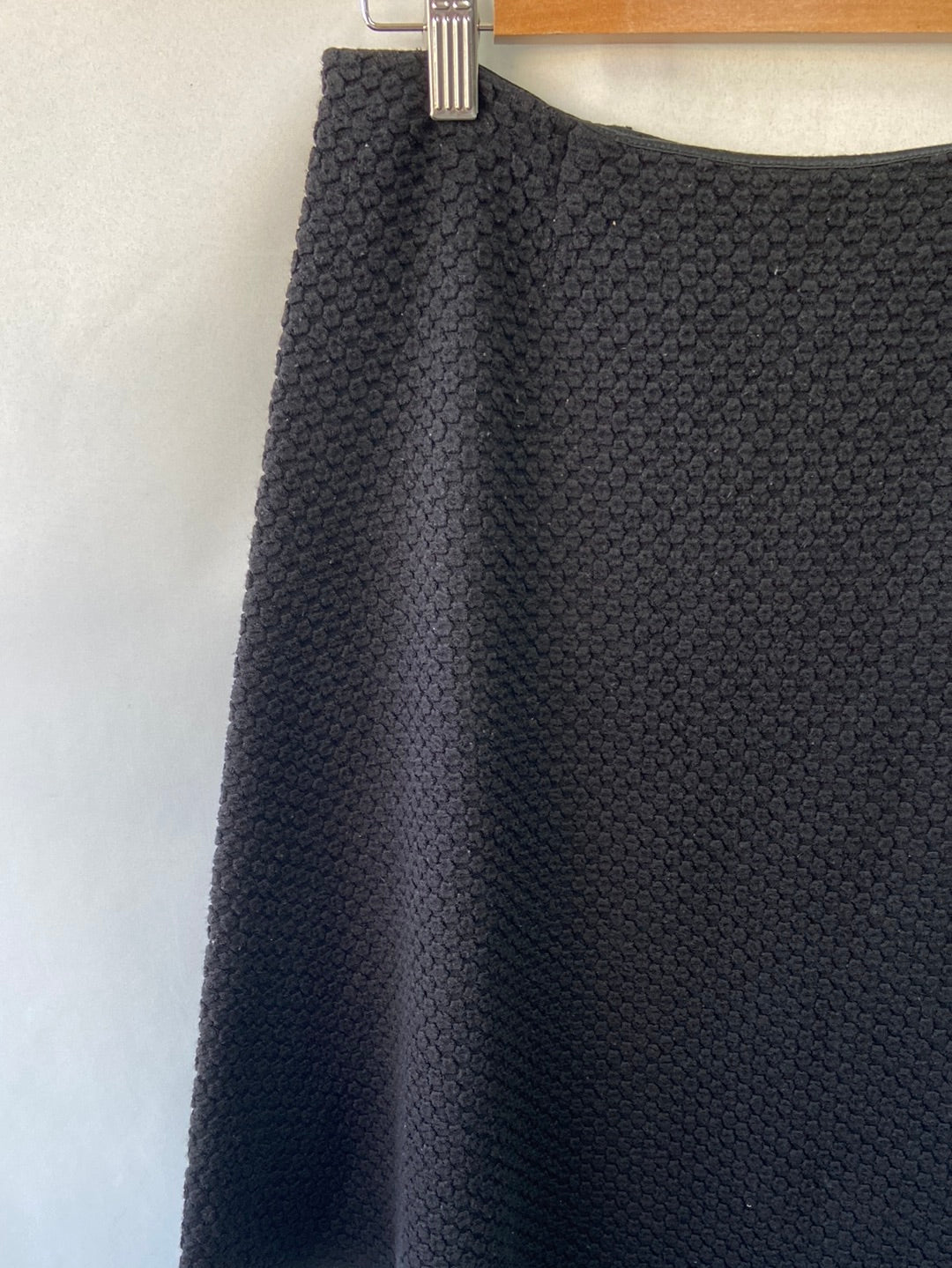 EMPORIO ARMANI. Black textured short skirt, size 44