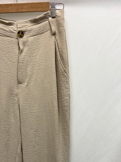 EASY WEAR. Flowing beige trousers size 36