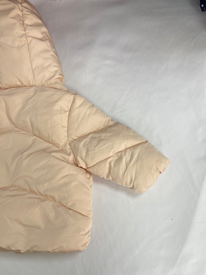 KIABI.Plumas beige rosita 9 meses