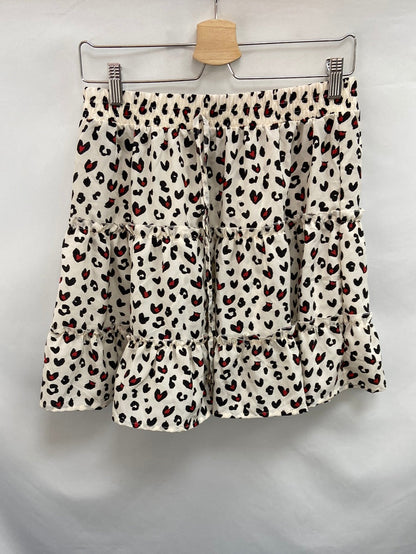 OTRAS. Falda vuelo animal print T.L