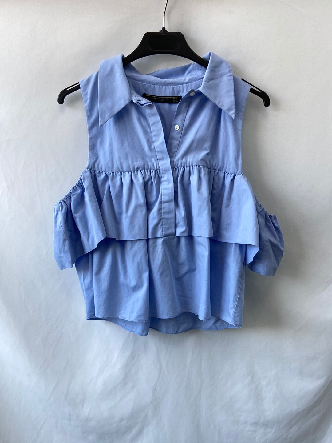 ZARA.Blusa azul volante T.S