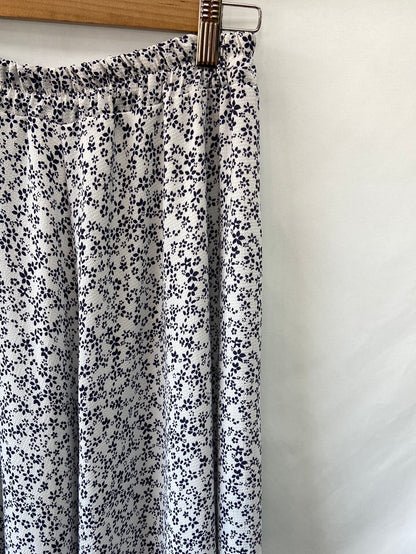 OTRAS.Falda midi flores T.M/L