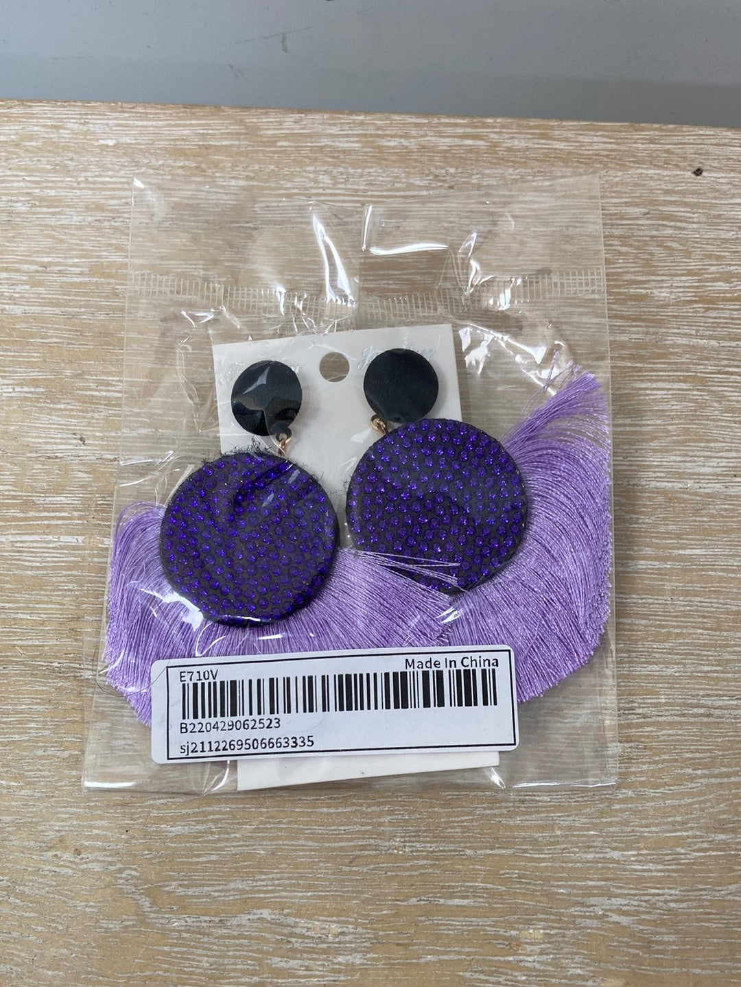 OTRAS.Pendientes morados flecos