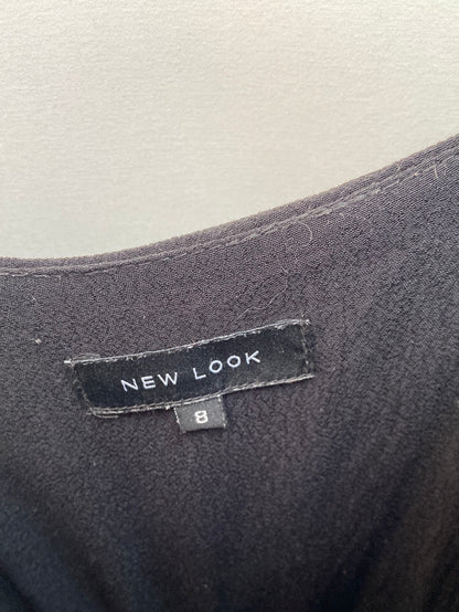 NEW LOOK.Mono corto negro flecos T.36