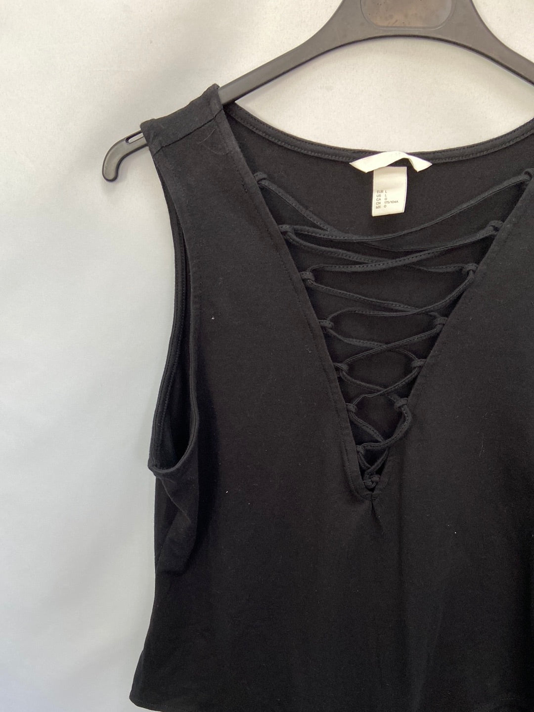 H&M.Body negro cuerdas T.L