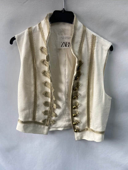 ZARA.Chaleco beige y dorado T.s