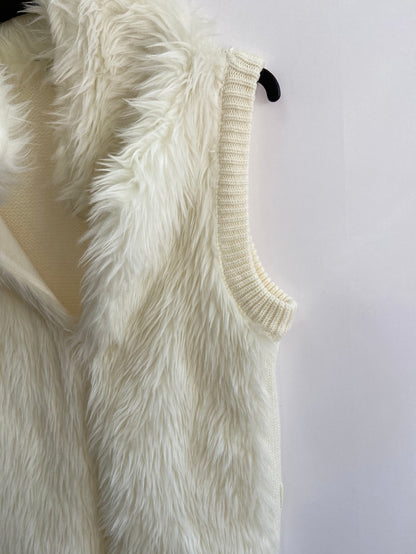 OTRAS.Chaleco blanco roto pelo y punto T.M