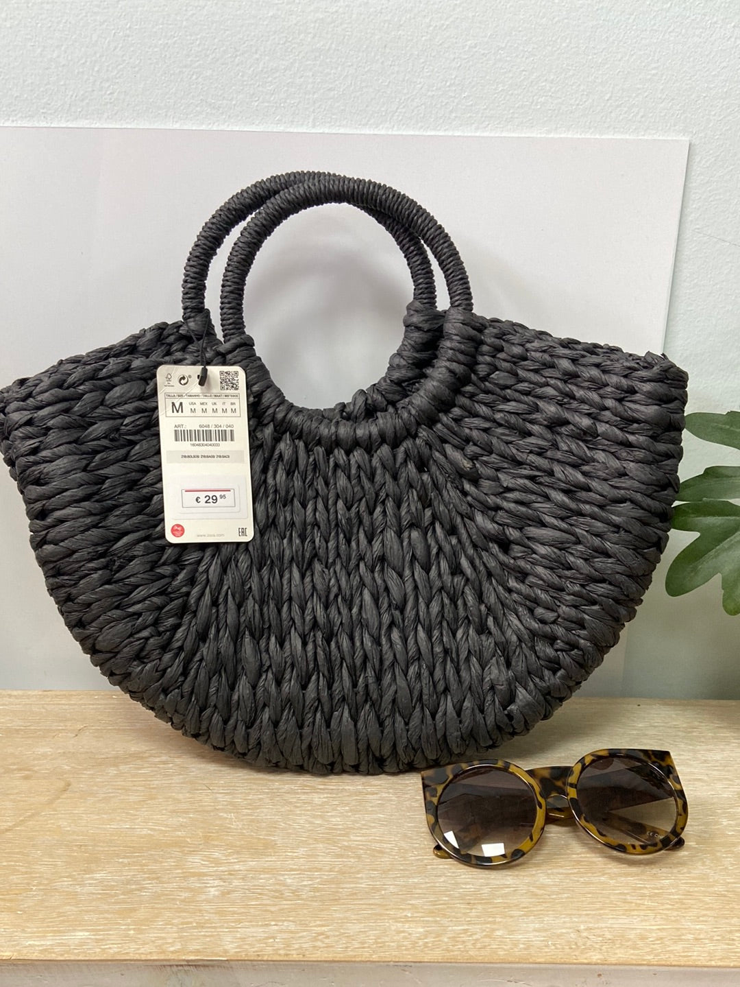 ZARA. Black semicircle raffia basket
