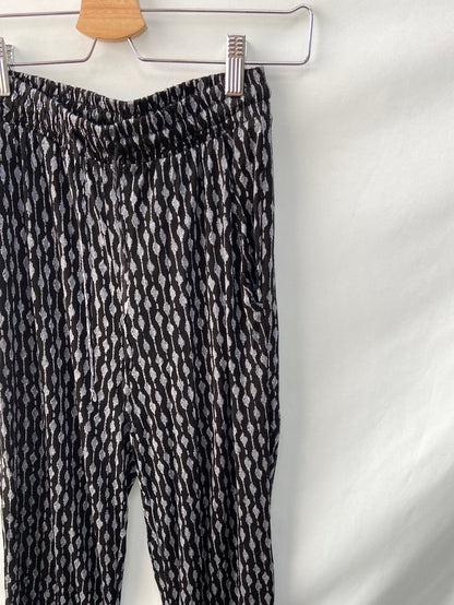 H&M. Pantalón elástico T. XS
