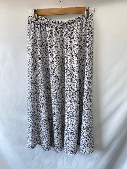 OTRAS.Falda midi flores T.M/L