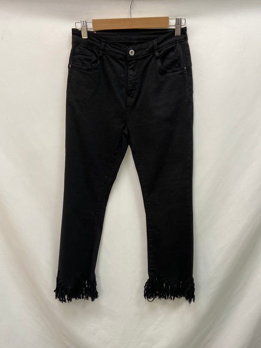OTRAS.vaqueros negros flecos T.38