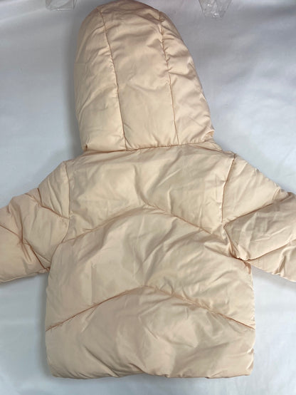 KIABI.Plumas beige rosita 9 meses