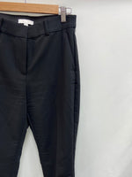 H&M.Pantalones básicos negros elásticos T.38