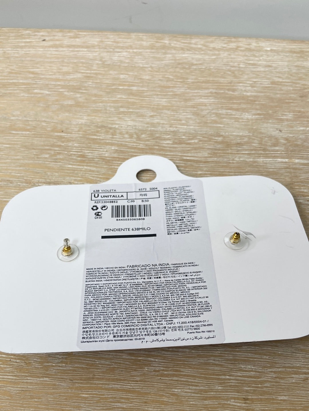 MANGO(VIOLETA).Pendientes flor flecos