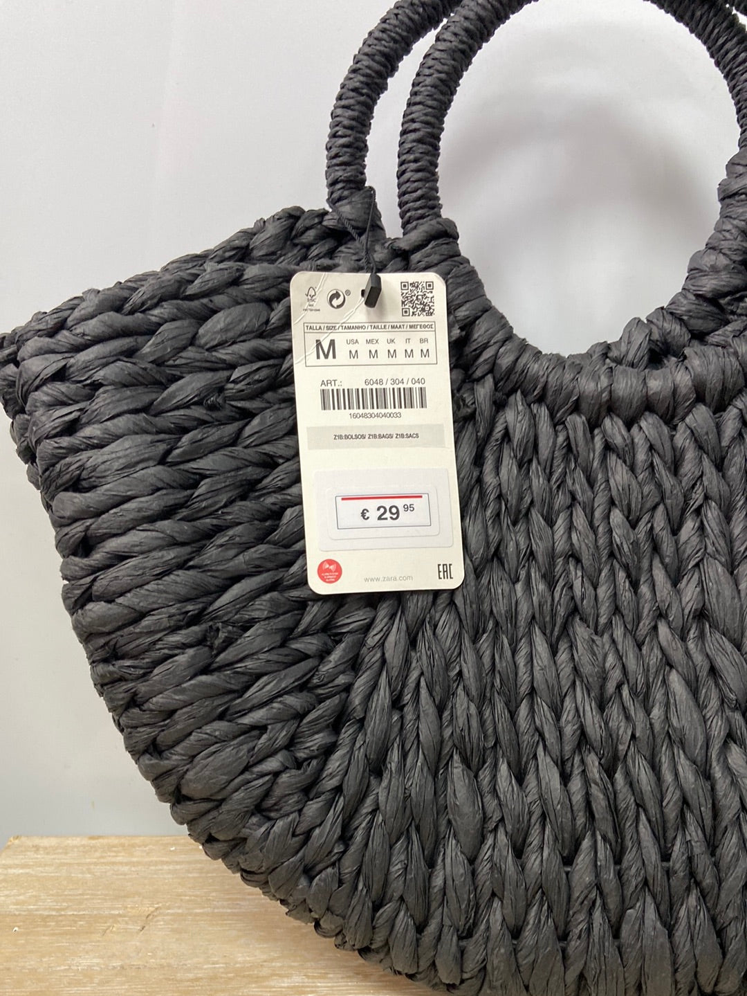 ZARA. Black semicircle raffia basket
